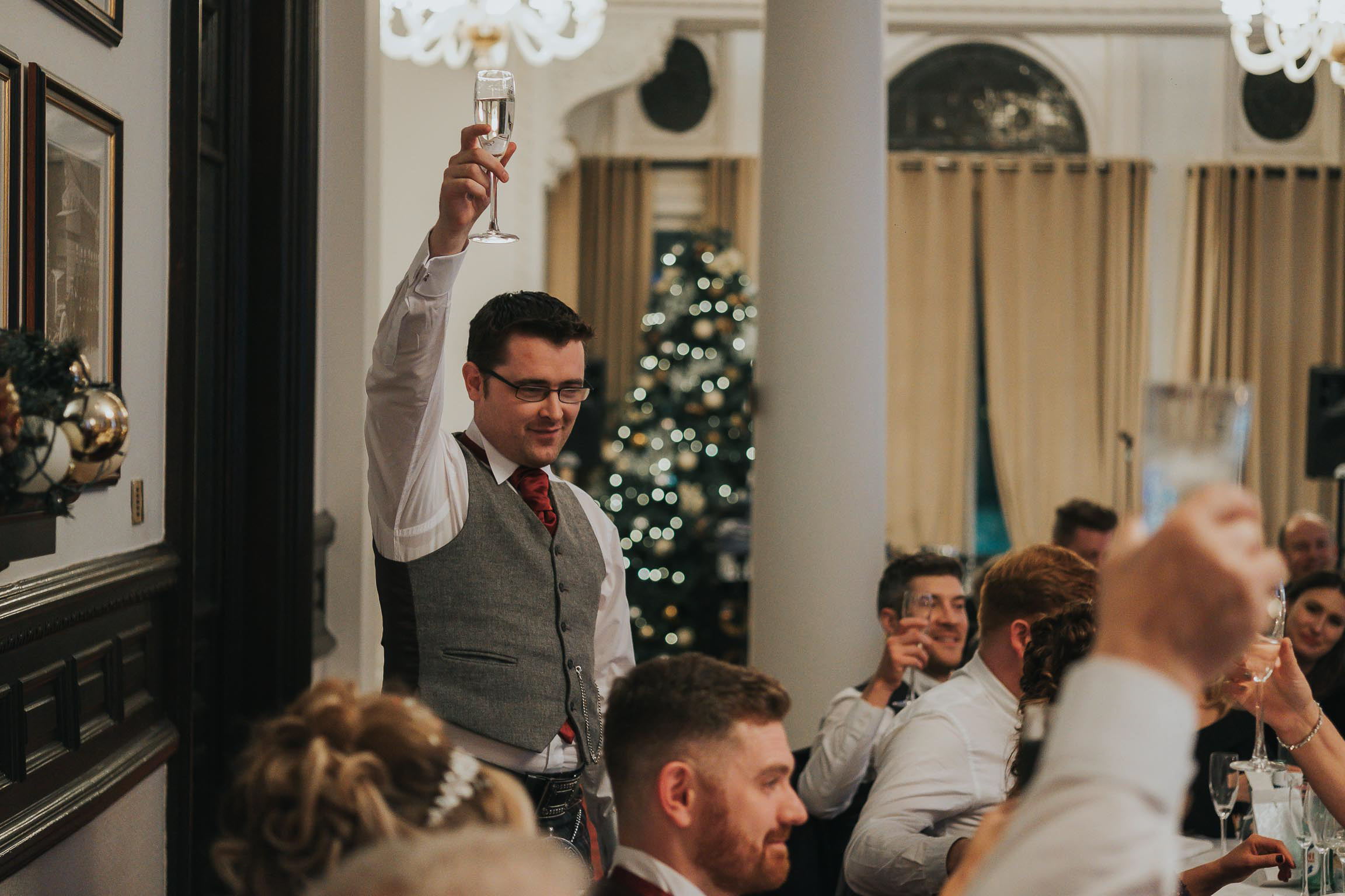 the best man toasts the happy couple during his best mans speech