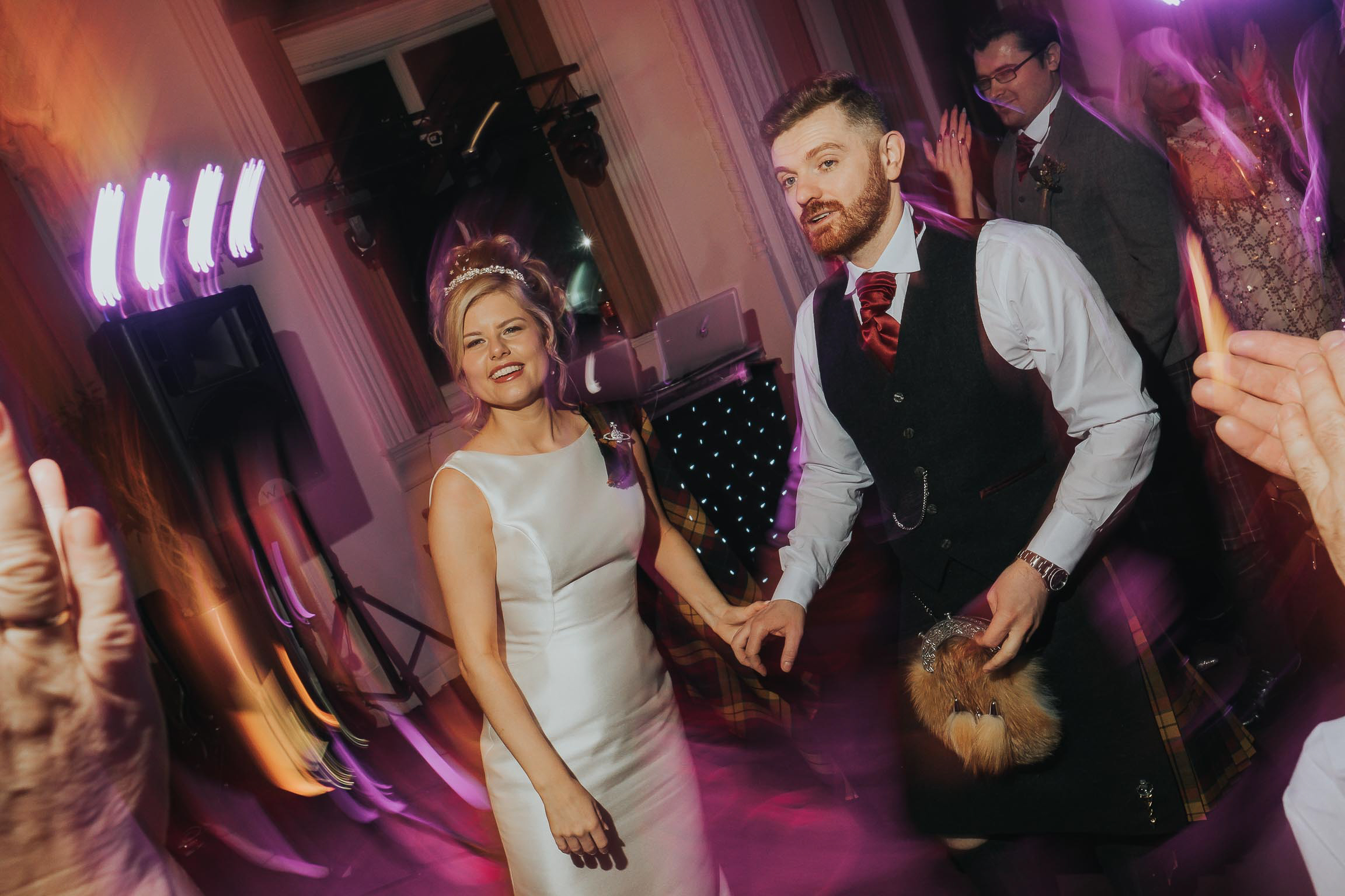 Bride and groom enjoying their wedding party on New Years eve in Liverpool city centre