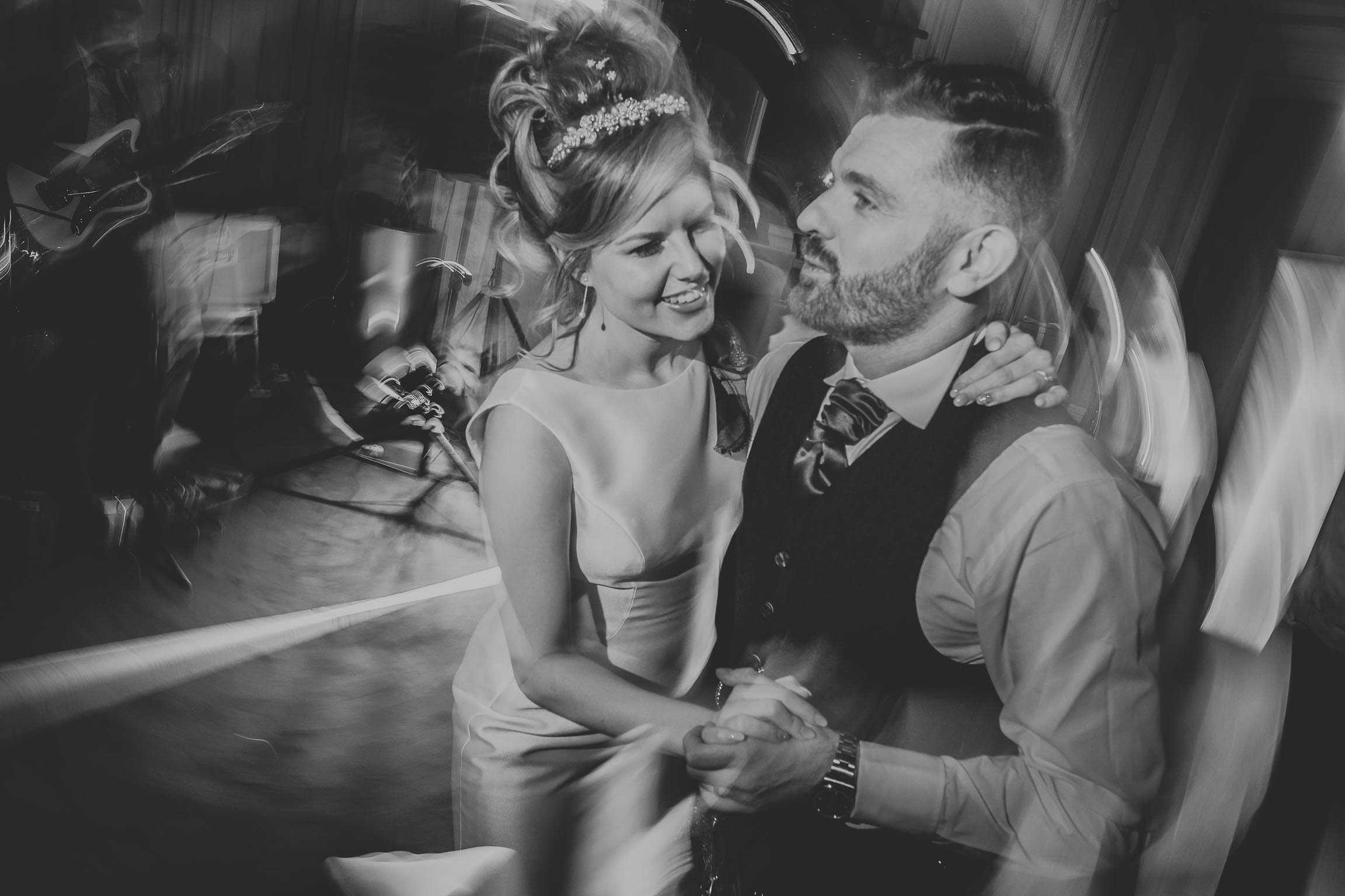 black and white image of a bride and groom during their first dance on their wedding day in Liverpool city centre