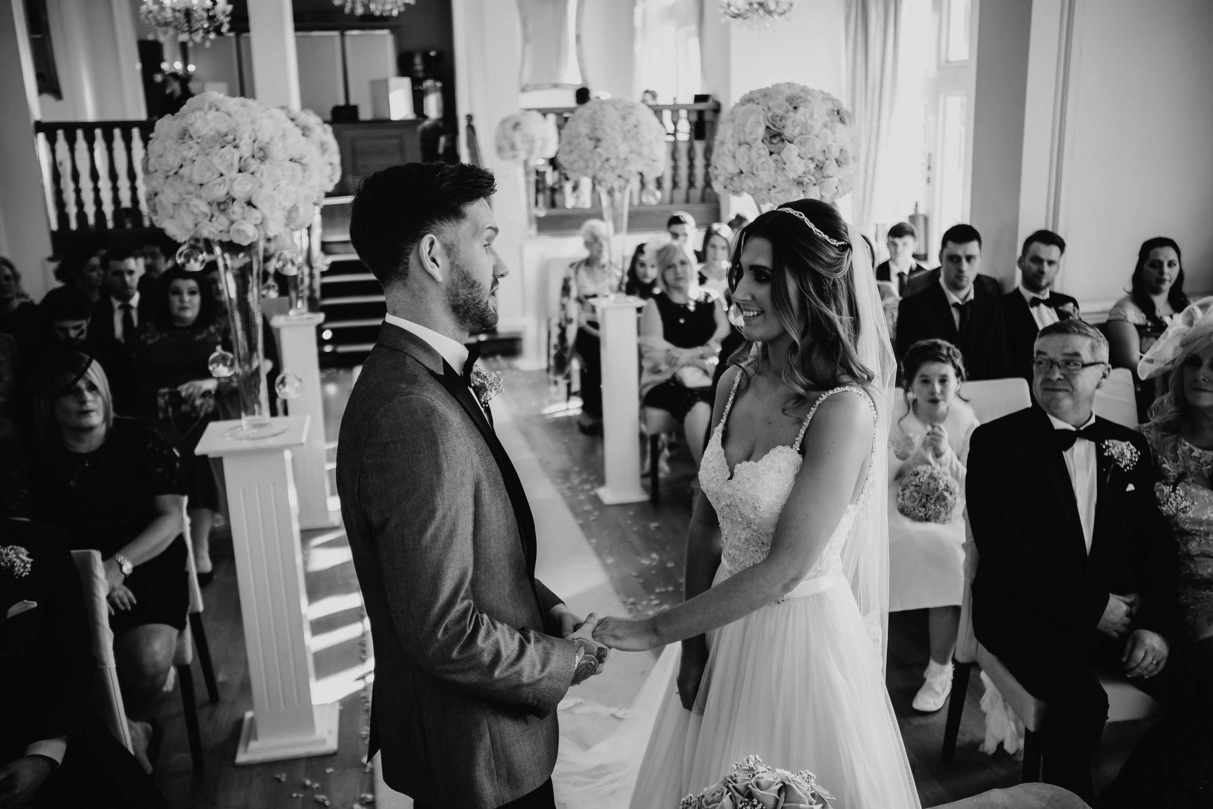 bride and groom during their wedding ceremony at west tower exclusive wedding venue in ormskirk