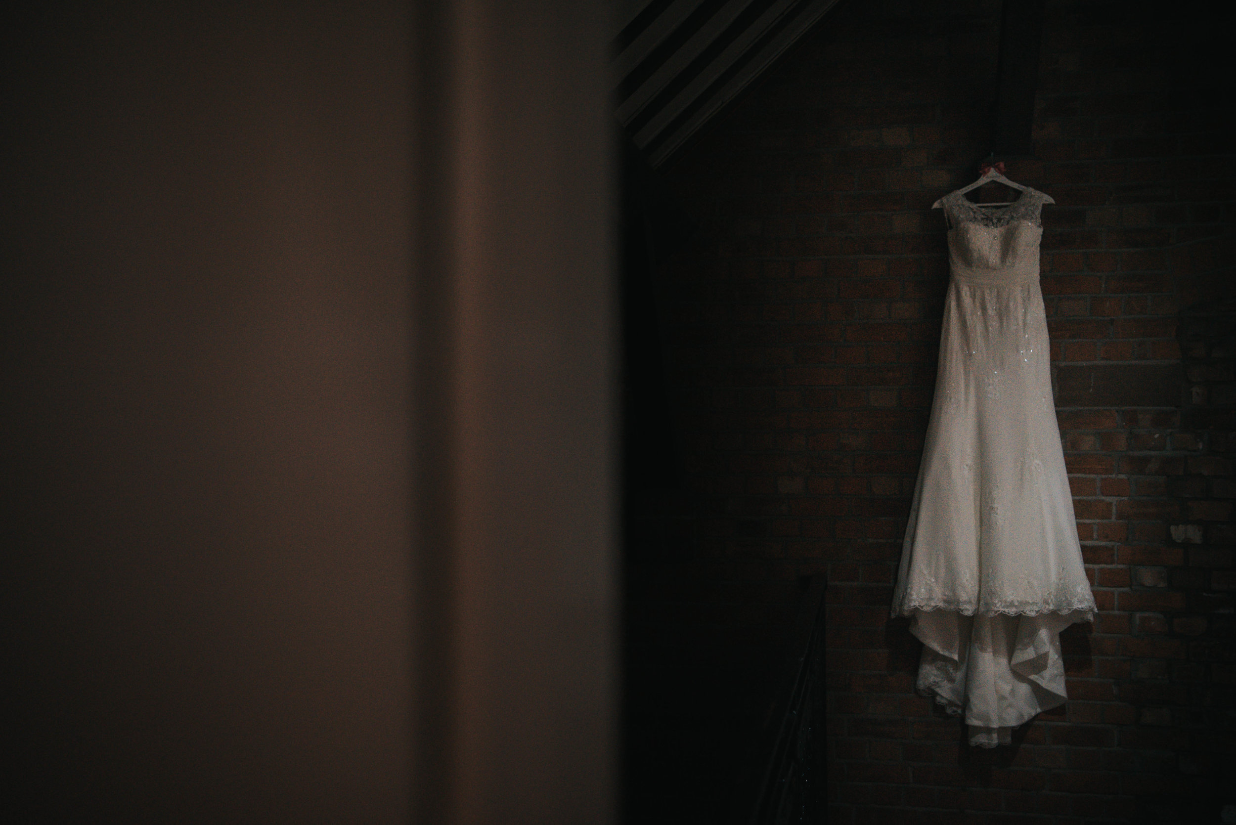 The wedding dress hanging in the Grosvenor Pulford on the wedding day