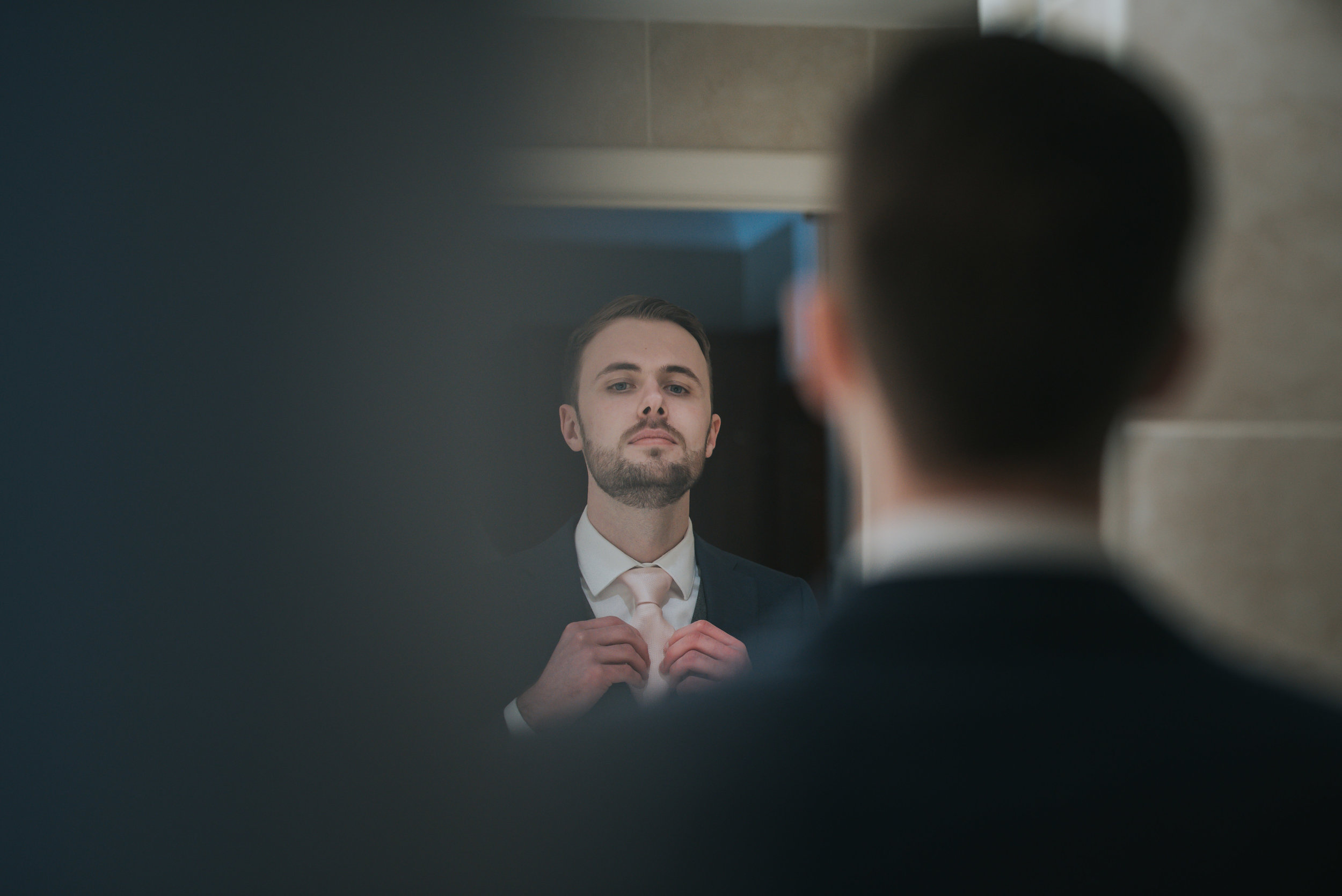 Groom getting ready for the ceremony at the Grosvenor Pulford