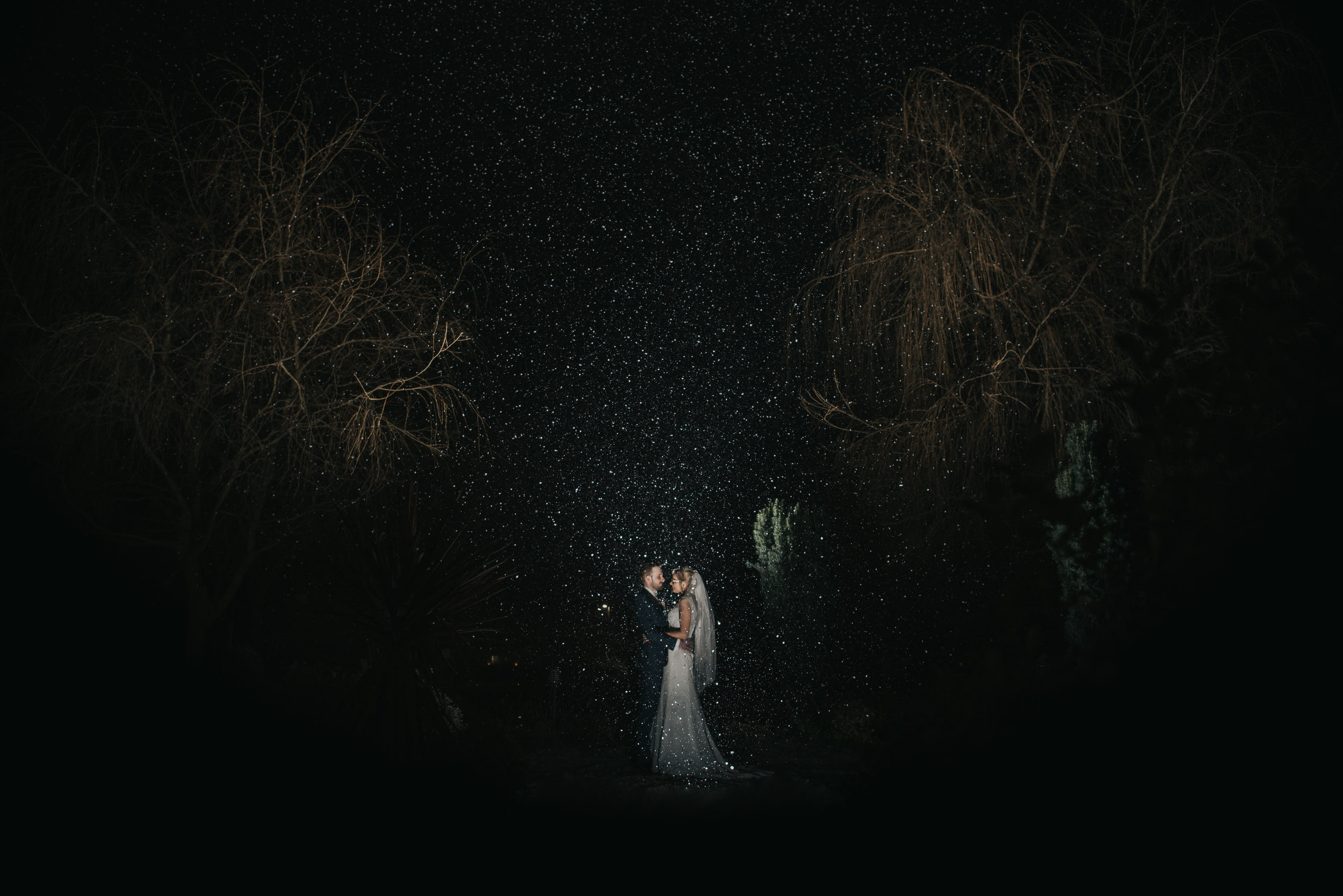 snowy night time portrait of the happy couple during their wedding at the Grosvenor Pulford