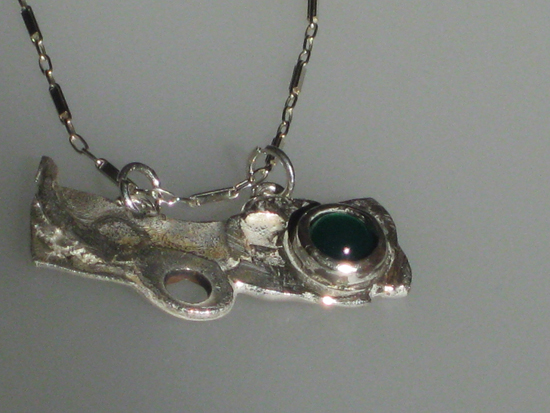 Detail of Silver with green garnet  $100.00