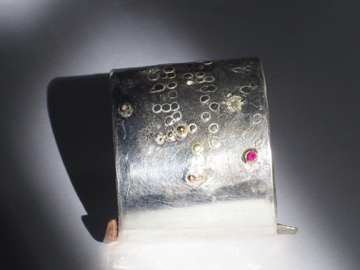Braille series Cuff- Sterling silver brass, 18kt gold and ruby $450 