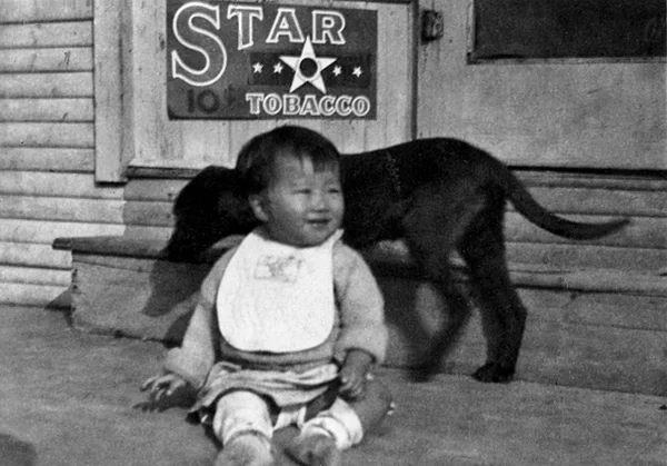 ^ Teruko, daughter of George Sakoguchi, by the front step of the grocery store at Allen & King streets in San Bernardino