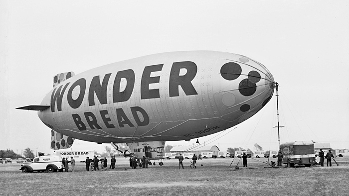 ^ Wonder Bread blimp "We went to see it! They had a raffle and, 'I hope, I hope, I hope it’s me that gets to ride!'…of course the odds were slim…they had a LOT of vendors who sold Wonder Bread. It was just my Pop & me who went, at