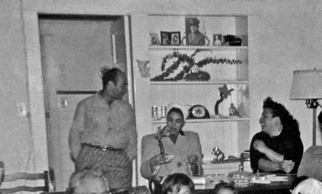 T.V. at 180 east Second street (detail) ^ Louis in doorway.........neighbor examining figurine.........Carmen in profile