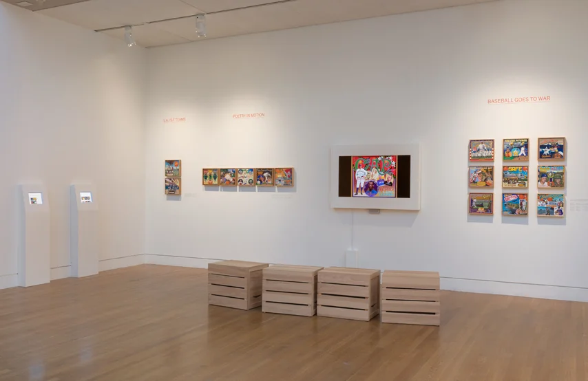 The two small screens at left featured images of all paintings in the exhibition, along with text by Albert Kilchesty