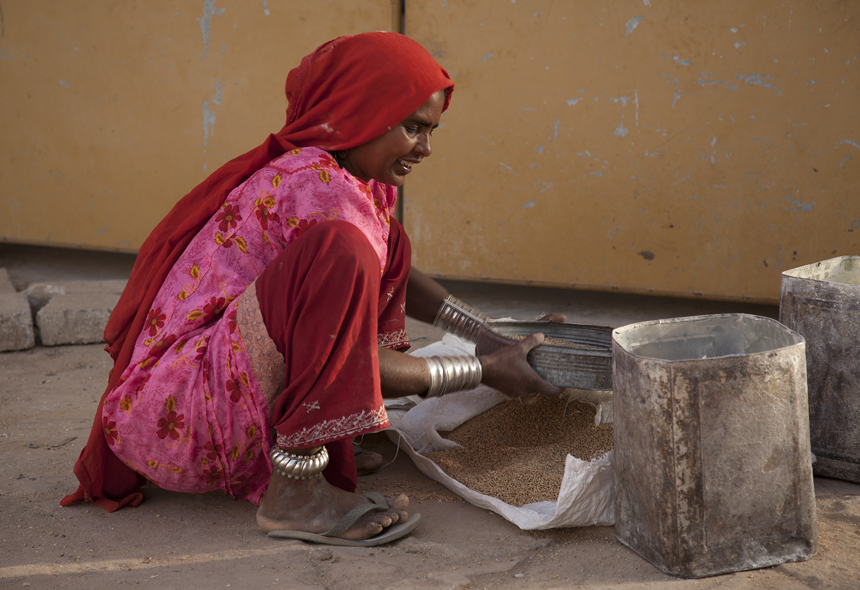 Sifting grain, Bhujodi, India