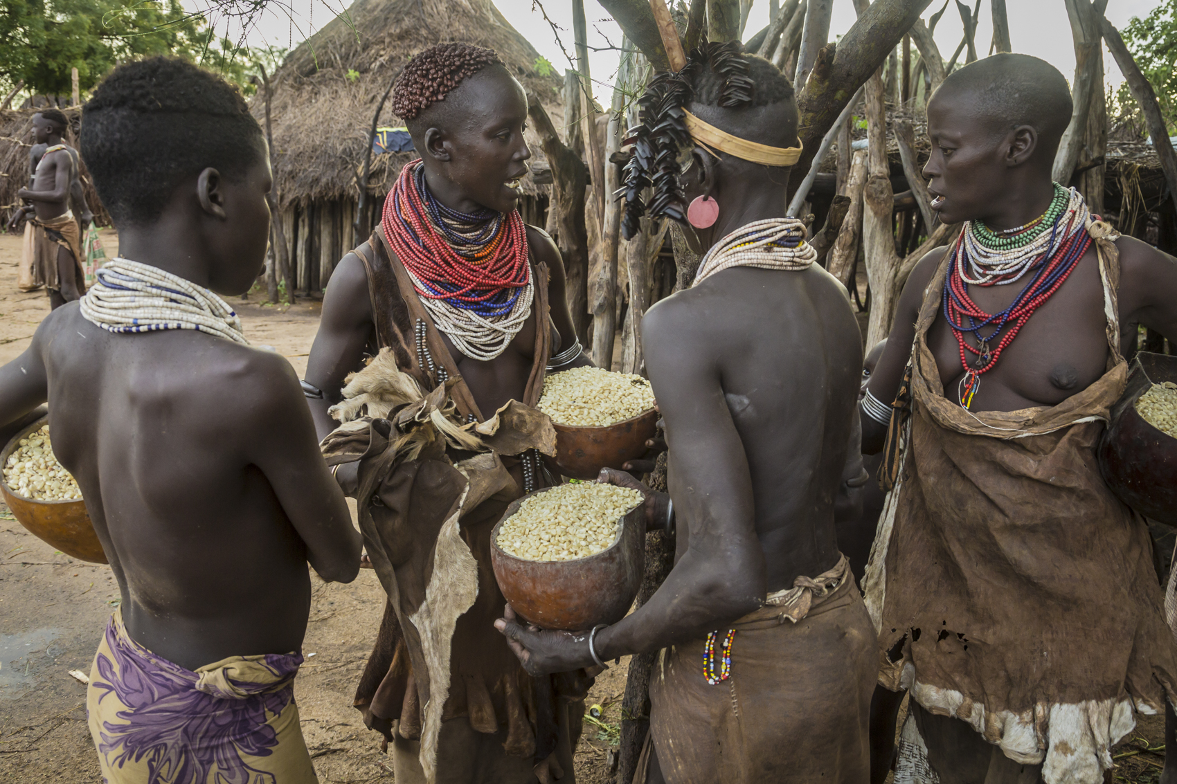 Kara women collecting corn