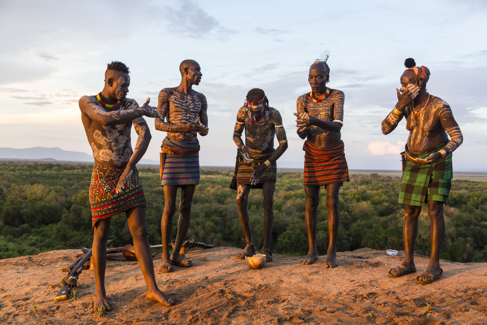 Kara men painting themselves