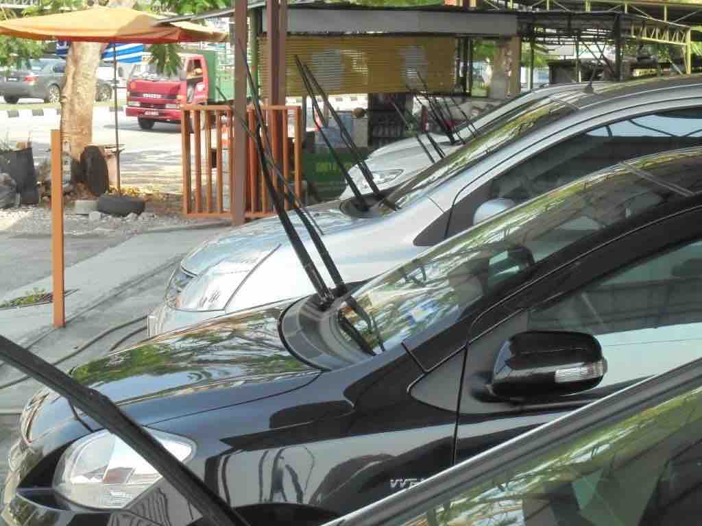 Windscreen wipers in car sales yards