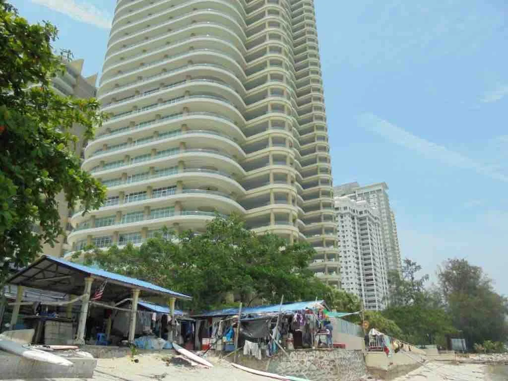 Fishermen's huts next to Gurney 8 super condo