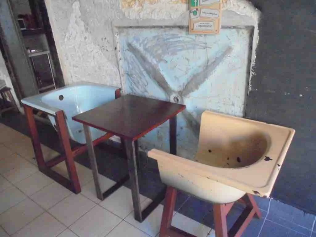 Old bath used as chairs in Cafe Kuching