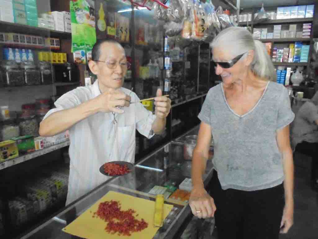 Father weighs Goji Berries