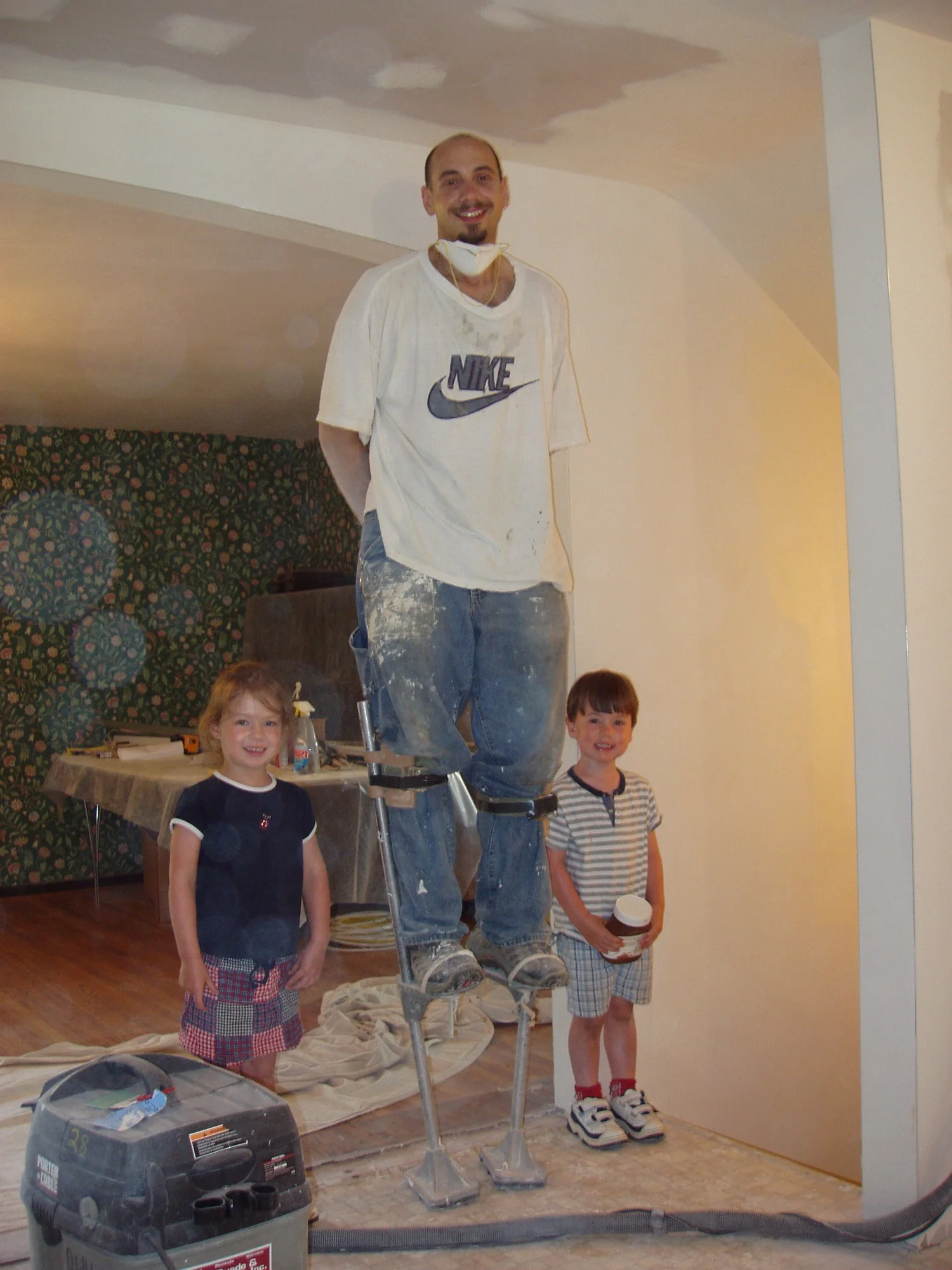 Greg on Stilts with Kids.jpg