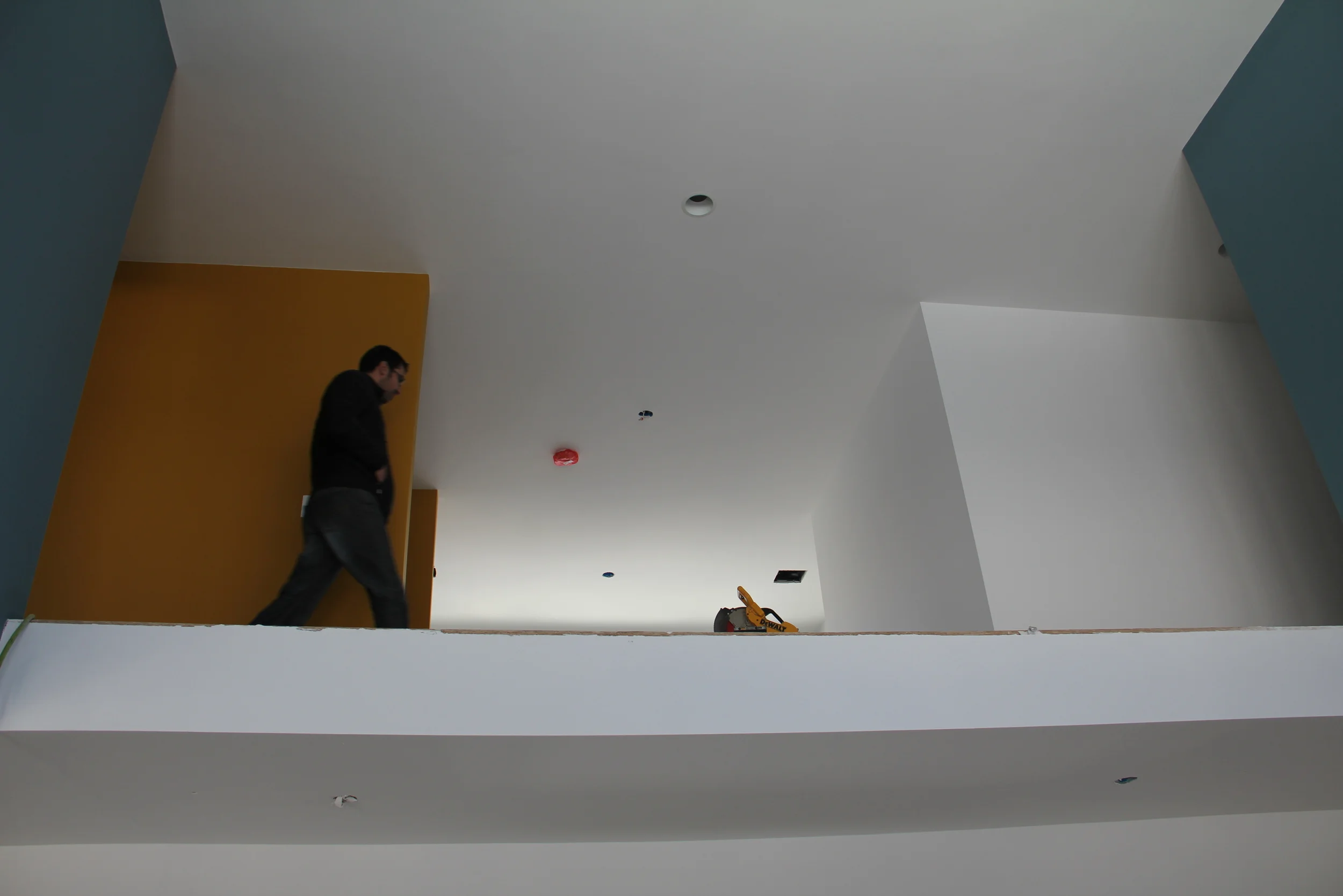 Looking up into the mezzanine, from the dining room area Project. Sunshine Residence, Design Build. KNK studios. Construction photo 2015.