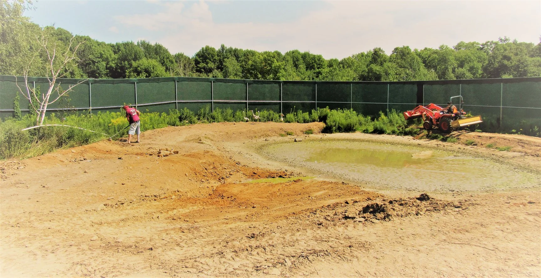 With most of the former pond drained, the remodeling begins.