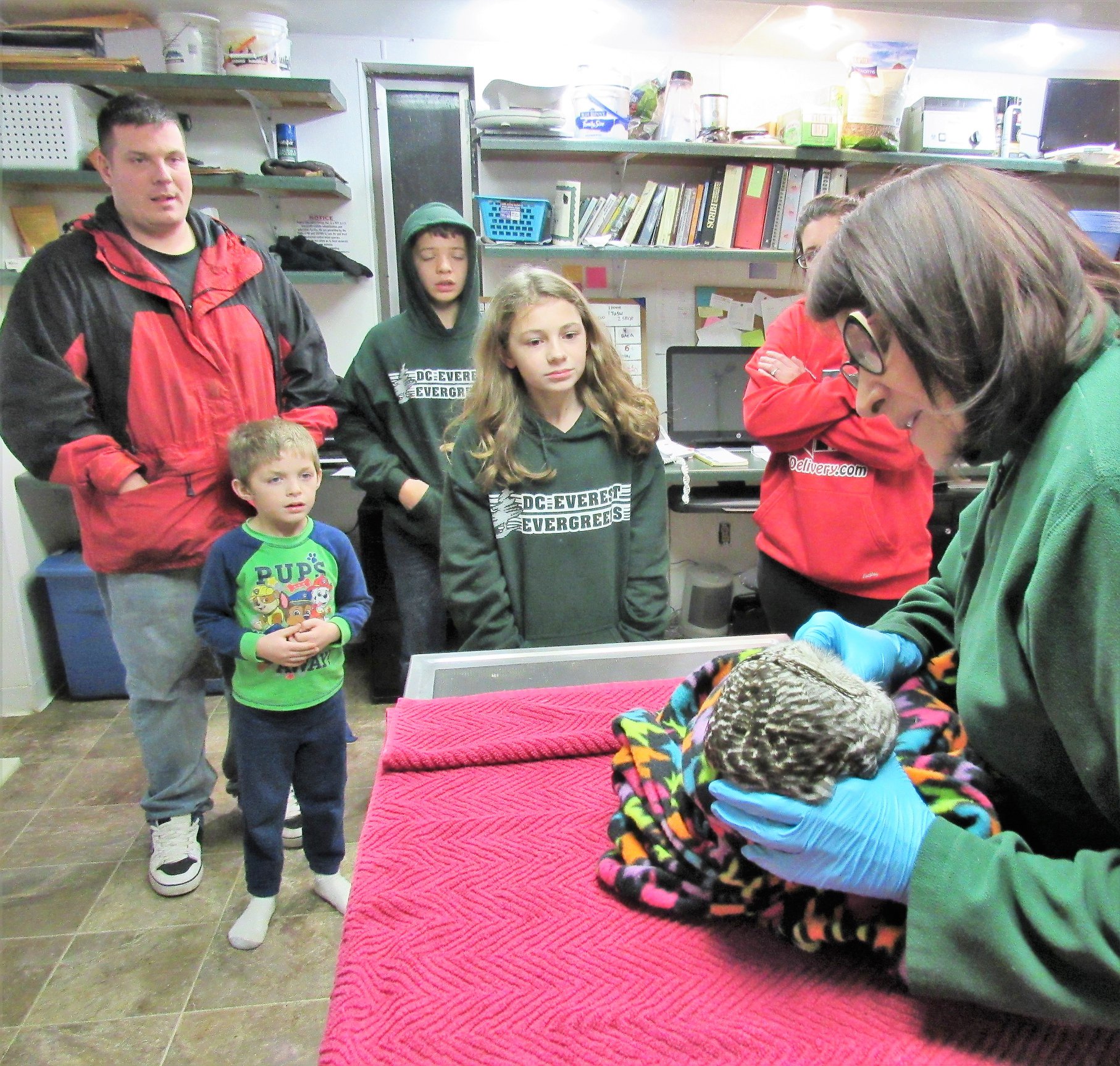 A huge part of our work at REGI is education. We love that our programs have touched this family. Here they observe the admission exam of the owl the rescued.