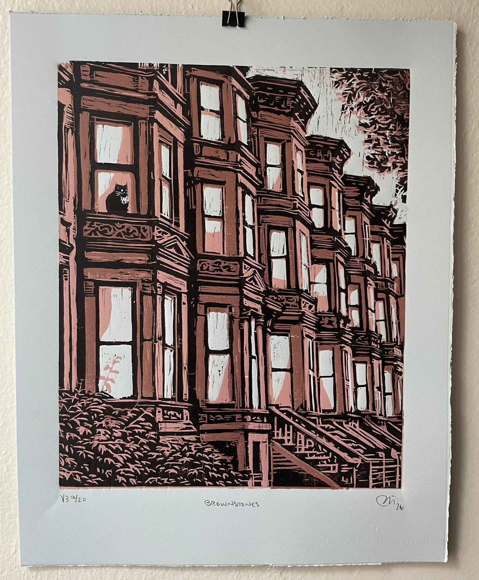 An original woodblock print of NYC's iconic Brownstones on blue paper