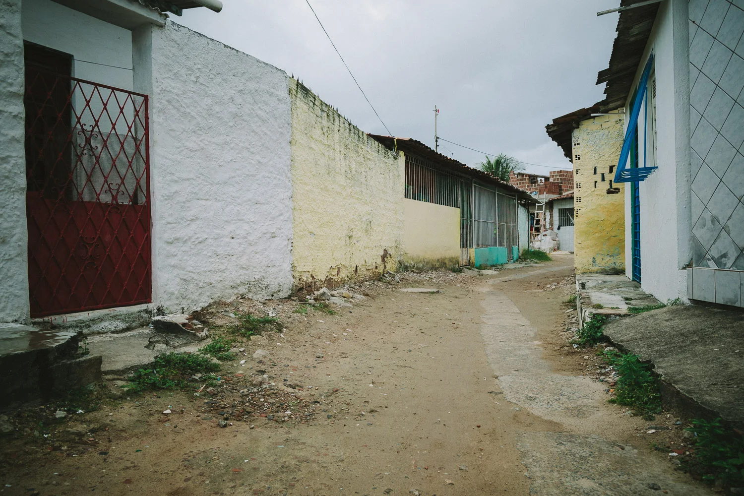 The neighborhood where Emidio lives is a very very poor section of the city with substantial poverty and high crime rate. Many of the houses are nothing more than pieces of thin wood and tin. In spite of this, many friendly people live there and are often generous with their smiles and kindness.