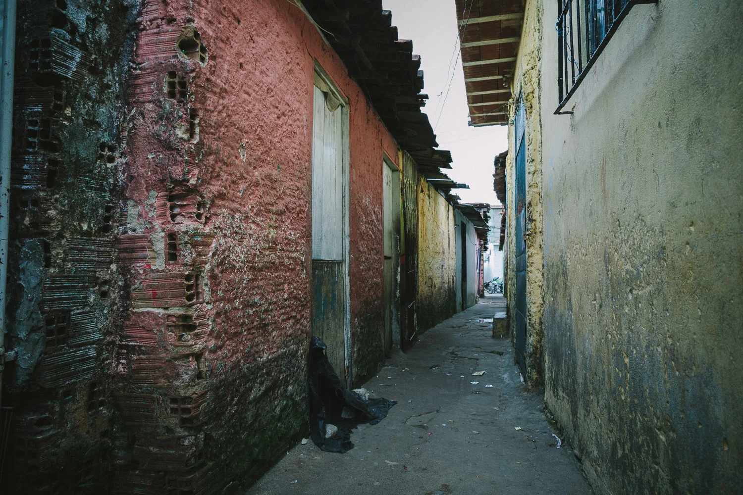 The neighborhood where Emidio lives is a very very poor section of the city with substantial poverty and high crime rate. Many of the houses are nothing more than pieces of thin wood and tin. In spite of this, many friendly people live there and are often generous with their smiles and kindness.
