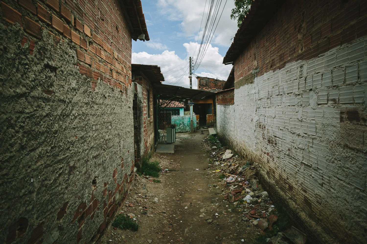The neighborhood where Emidio lives is a very very poor section of the city with substantial poverty and high crime rate. Many of the houses are nothing more than pieces of thin wood and tin. In spite of this, many friendly people live there and are often generous with their smiles and kindness.