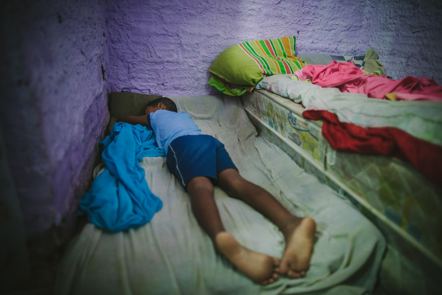   Emidio starts his day waking up from a very thin mattress on the floor. Emidio's entire house (housing 4 people---soon to be 5) is perhaps no larger than 8 feet by 10 feet. This is Emidio's morning routine before heading to classes at the Compassio