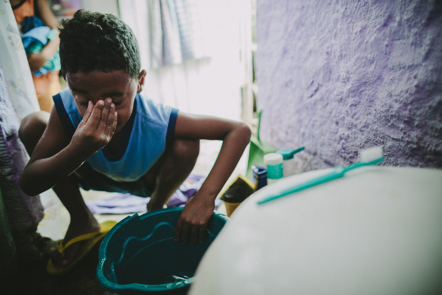   The space where Emidio washes his face in the morning is the same space where the family does all their bathroom, kitchen, and sleeping activities. Emidio's entire house (housing 4 people---soon to be 5) is perhaps no larger than 8 feet by 10 feet.