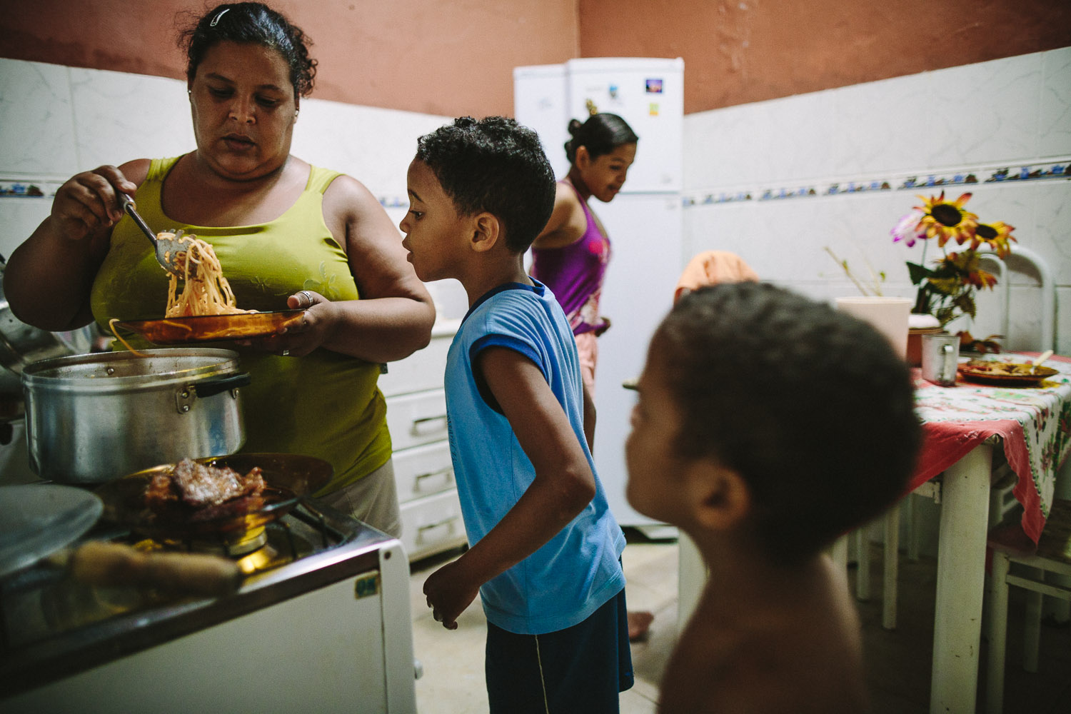   Emidio and his brother are feed lunch and dinner during the week by a family friend. Each day an "aunt" (family friend--relation) takes care of Emidio and his younger brother between his time at the Compassion Center and School since his mother wor