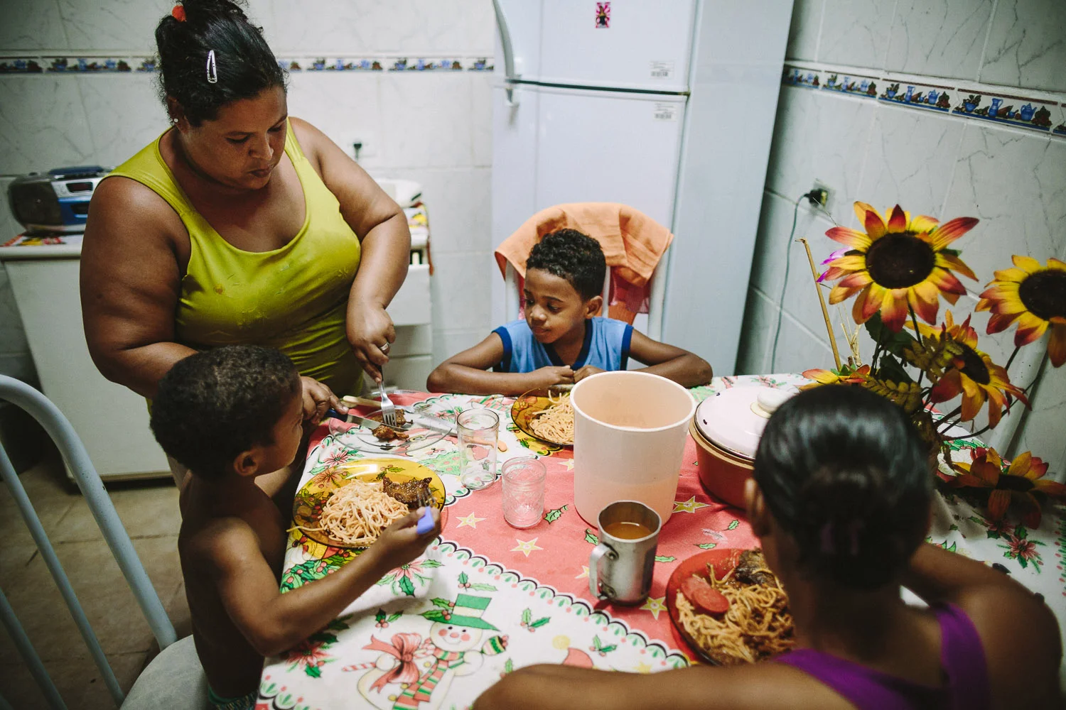Each day an "aunt" (family friend--relation) takes care of Emidio and his younger brother between his time at the Compassion Center and School since his mother works until 10pm at night.
