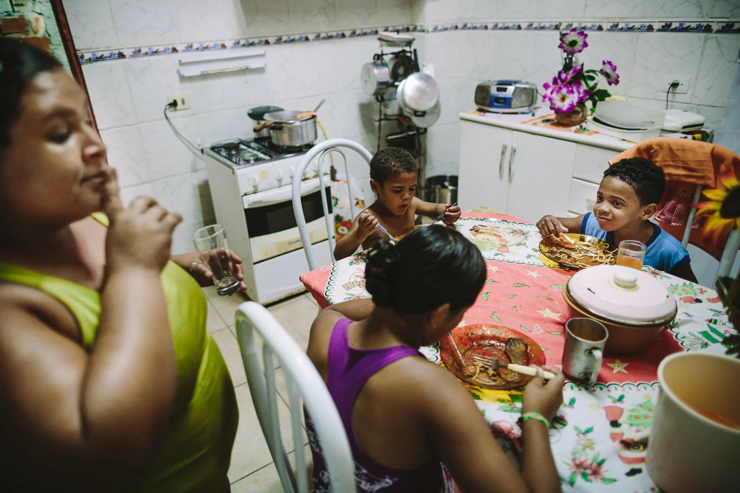 Emidio is a very talkative boy and full of life. Sometimes he needs to be reminded to speak softer during meals (as in this photo). Each day an "aunt" (family friend--relation) takes care of Emidio and his younger brother between his time at the Compassion Center and School since his mother works until 10pm at night.