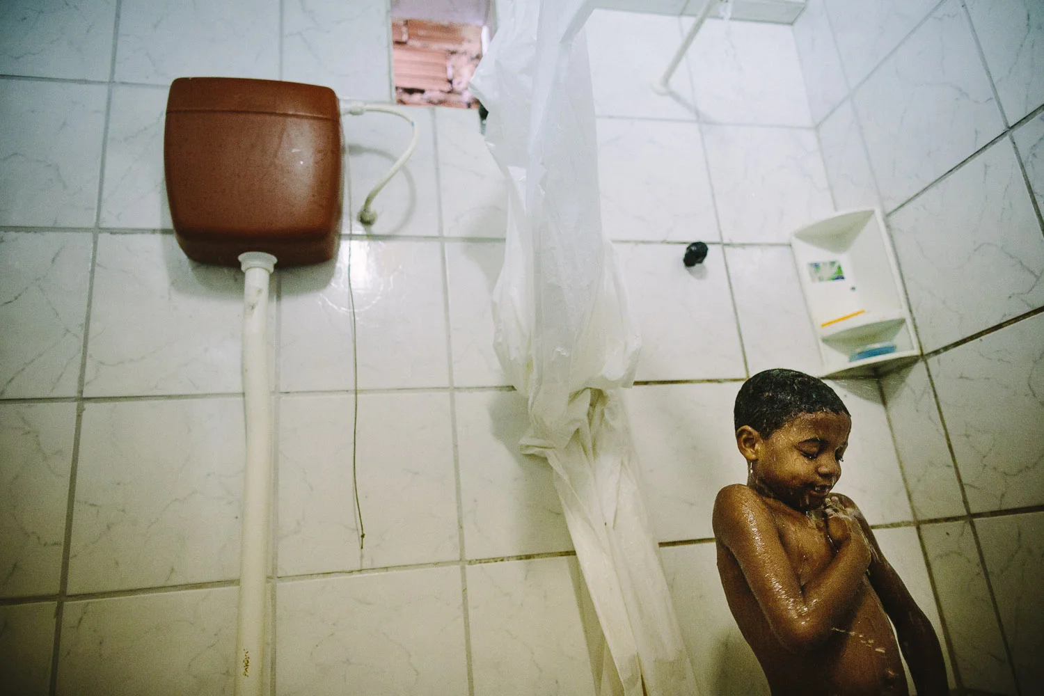 Even though Emidio is poor by our standards the joy of a cool shower is universal. Each day an "aunt" (family friend--relation) takes care of Emidio and his younger brother between his time at the Compassion Center and School since his mother works until 10pm at night.
