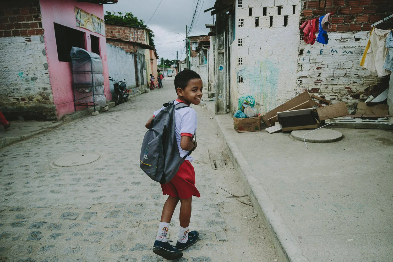 After eating lunch and taking his shower and getting ready at his "aunt's" house (family friend---no relation), Emidio walks to his school.