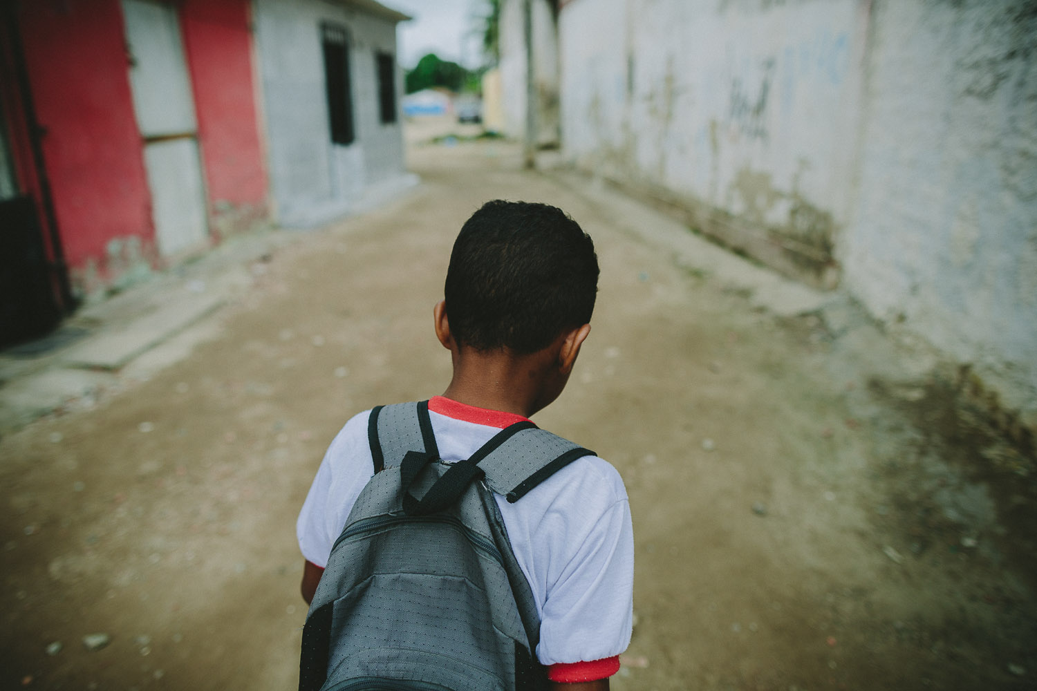   After eating lunch and taking his shower and getting ready at his "aunt's" house (family friend---no relation), Emidio walks to his school.  