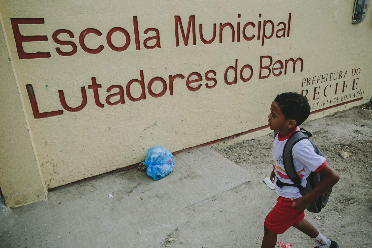   After eating lunch and taking his shower and getting ready at his "aunt's" house (family friend---no relation), Emidio walks to his school.  