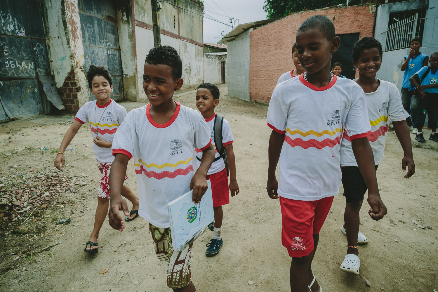   As he nears his school, Emidio is joined by his school friends. After eating lunch and taking his shower and getting ready at his "aunt's" house (family friend---no relation), Emidio walks to his school.  