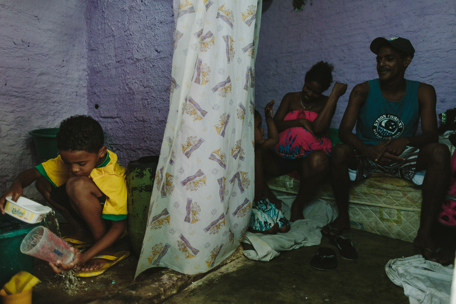   During certain days of the week, Emidio helps his mother by doing the dishes. Emidio's entire house (housing 4 people---soon to be 5) is perhaps no larger than 8 feet by 10 feet. As a result, the space where Emidio's family do their bathroom, kitch