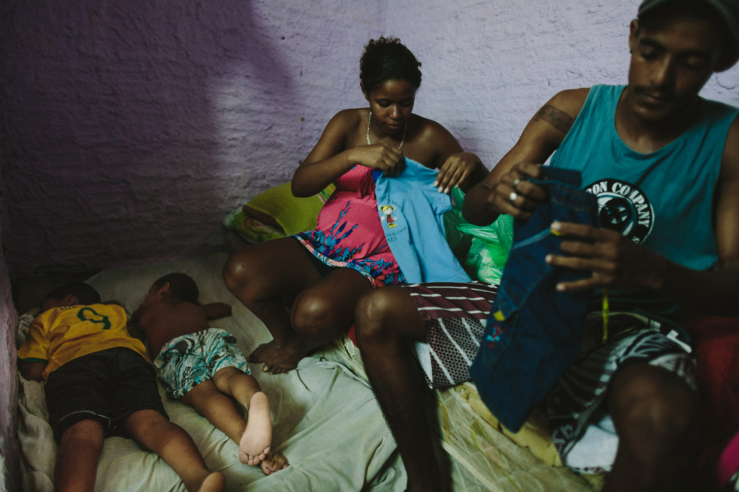   Emidio and his younger brother turn in for the night while his mother and her friend fold their clothes and get things ready for the next day. Emidio's entire house (housing 4 people---soon to be 5) is perhaps no larger than 8 feet by 10 feet. As a