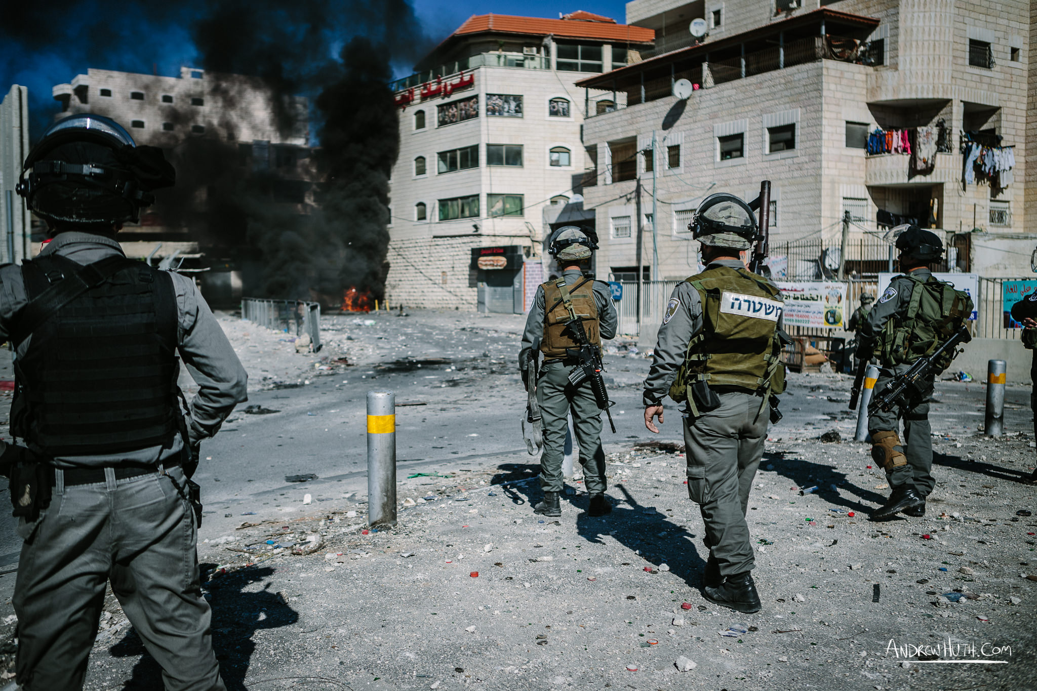  Israeli military using tear gas and guns in an armed conflict with the residents of Shu'afat Refugee Camp.  Palestinian youth clash with Israeli military in Shu'afat Refugee Camp in East Jerusalem on Friday, November 7, 2014. &nbsp;The recent, but t