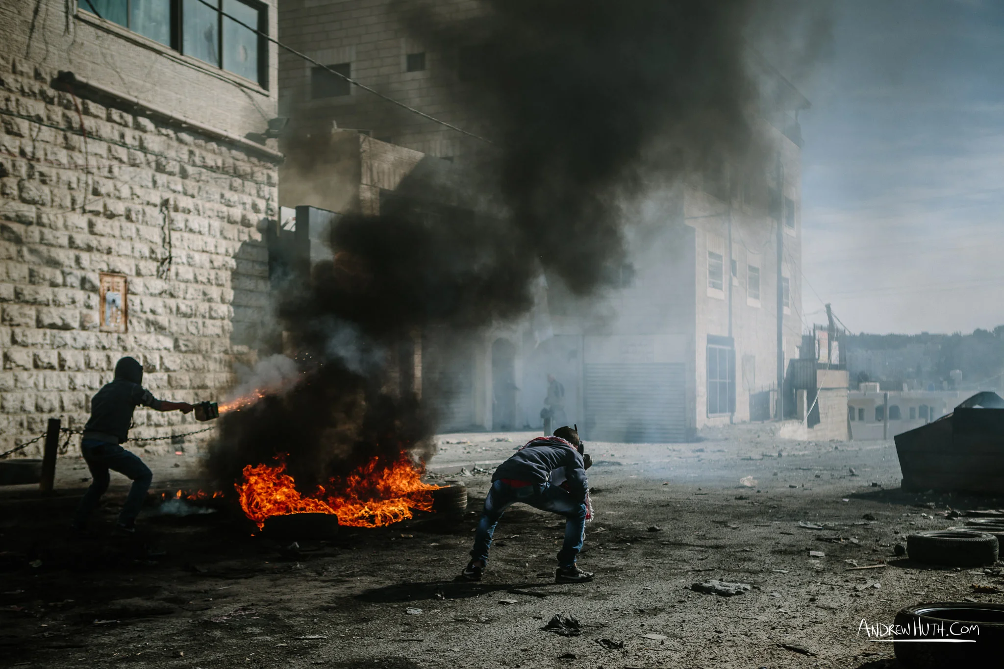 Palestinian youth clash with Israeli military in Shu'afat Refugee Camp in East Jerusalem on Friday, November 7, 2014. The recent, but temporarily total closure of one of Muslim's holiest sites, the Al-Aqsa Mosque, (the first since 1967) and the subsequent limited access for many Muslims to the mosque since has raised tension between Israeli's military and the Arab community.