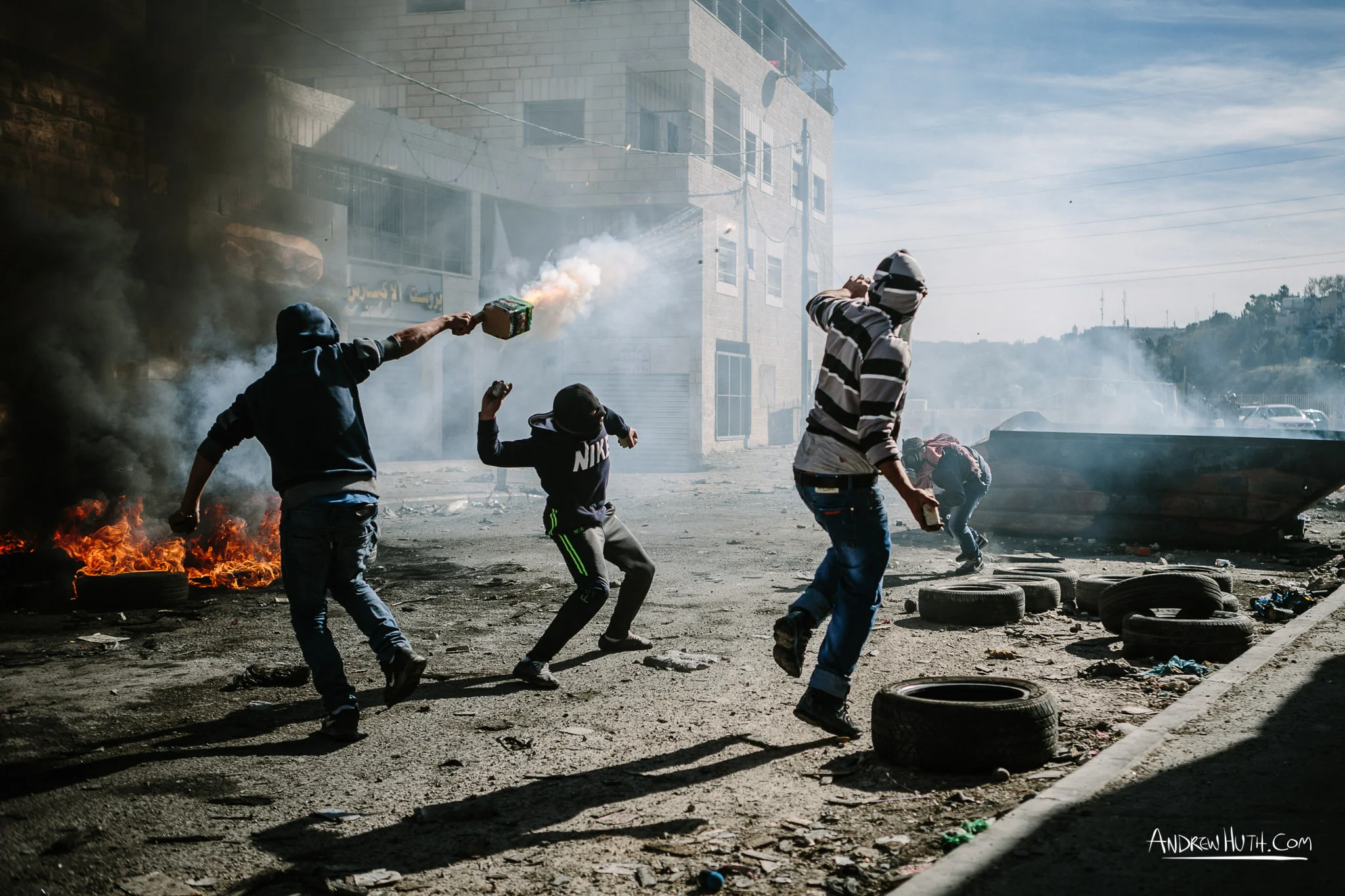 Palestinian youth clash with Israeli military in Shu'afat Refugee Camp in East Jerusalem on Friday, November 7, 2014. The recent, but temporarily total closure of one of Muslim's holiest sites, the Al-Aqsa Mosque, (the first since 1967) and the subsequent limited access for many Muslims to the mosque since has raised tension between Israeli's military and the Arab community.