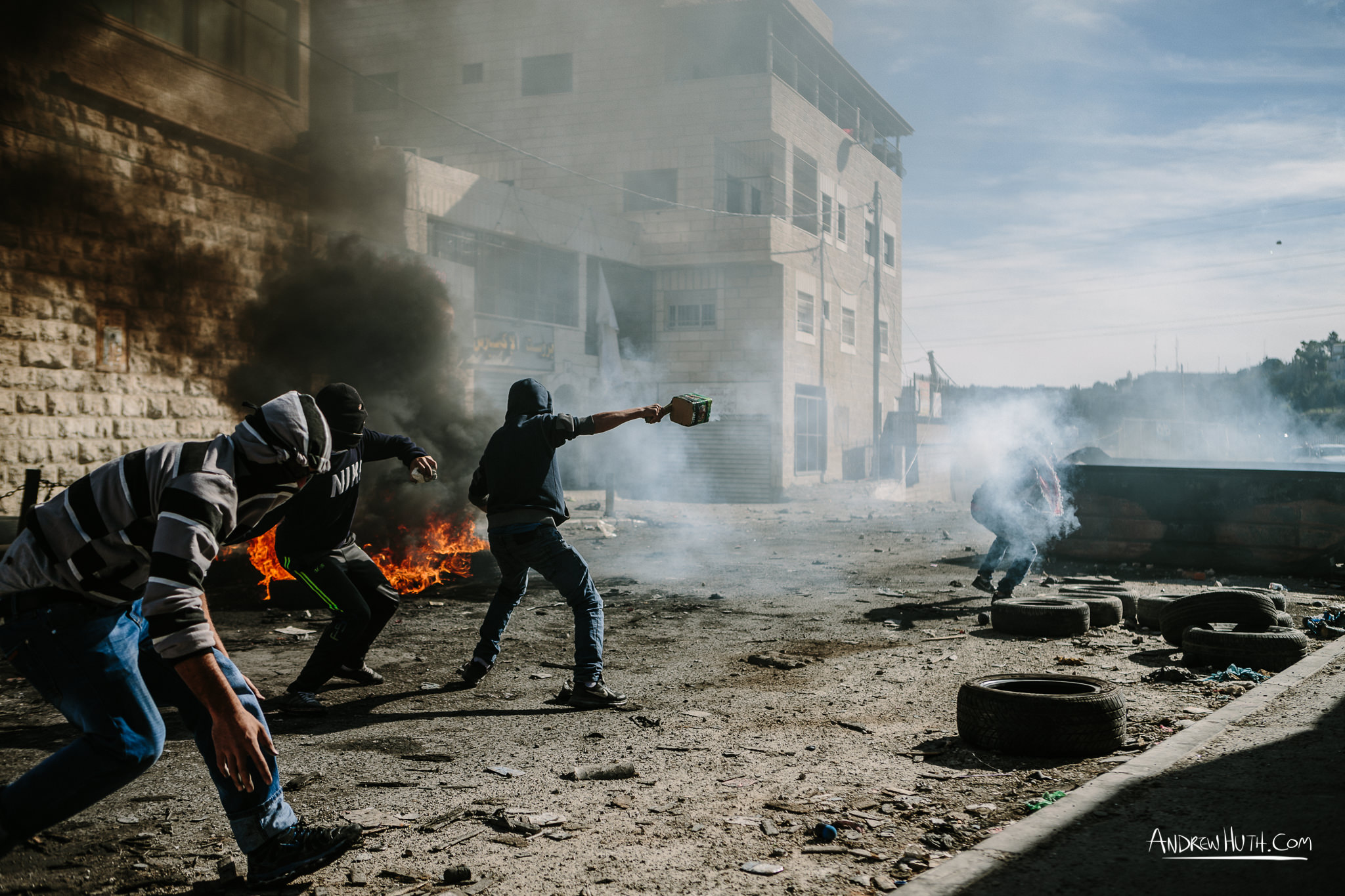 Palestinian youth clash with Israeli military in Shu'afat Refugee Camp in East Jerusalem on Friday, November 7, 2014. The recent, but temporarily total closure of one of Muslim's holiest sites, the Al-Aqsa Mosque, (the first since 1967) and the subsequent limited access for many Muslims to the mosque since has raised tension between Israeli's military and the Arab community.