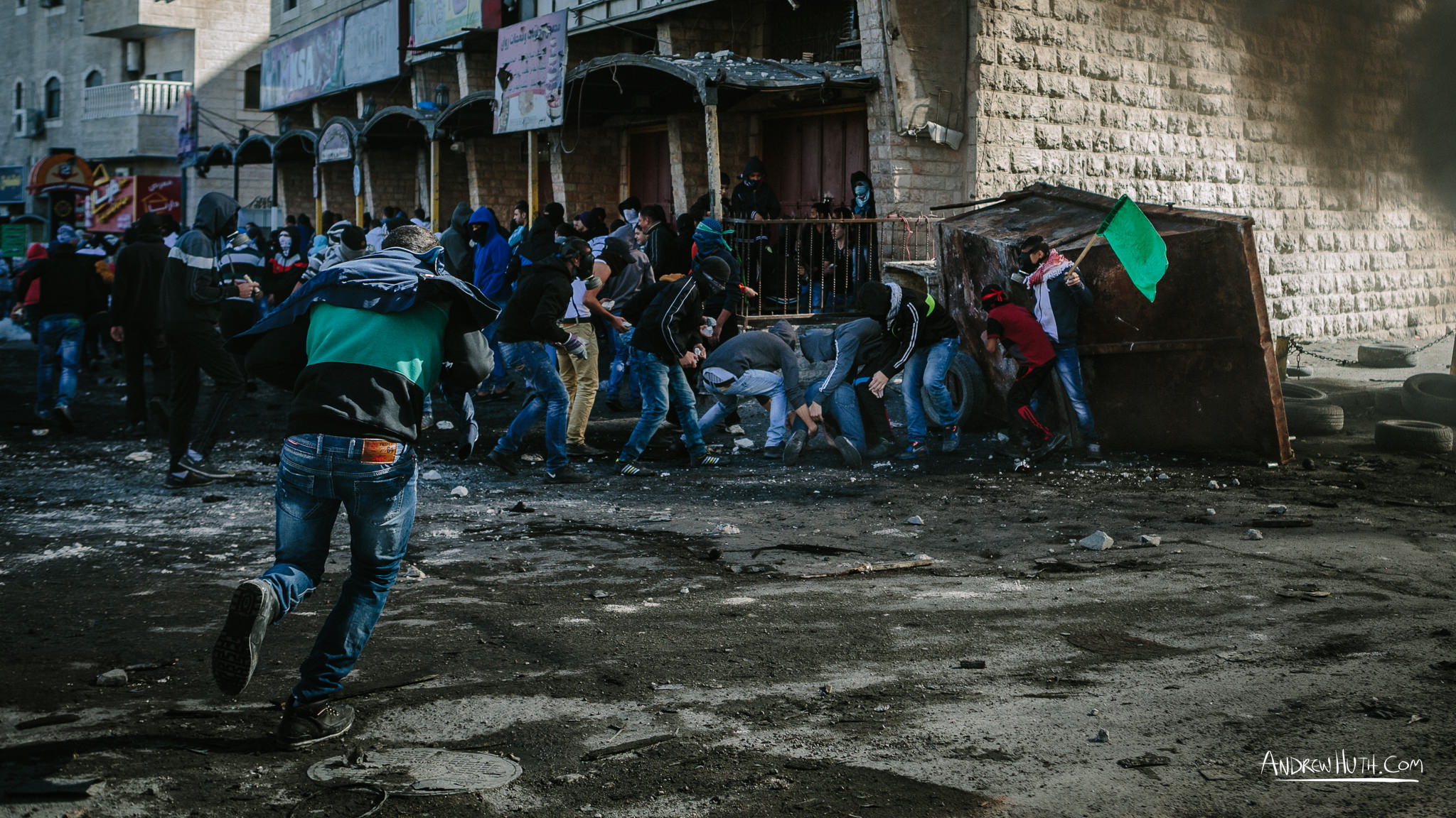  A Palestinian youth gets shot by Israeli military during a clash at Shu'afat Refugee Camp.  Palestinian youth clash with Israeli military in Shu'afat Refugee Camp in East Jerusalem on Friday, November 7, 2014. &nbsp;The recent, but temporarily total