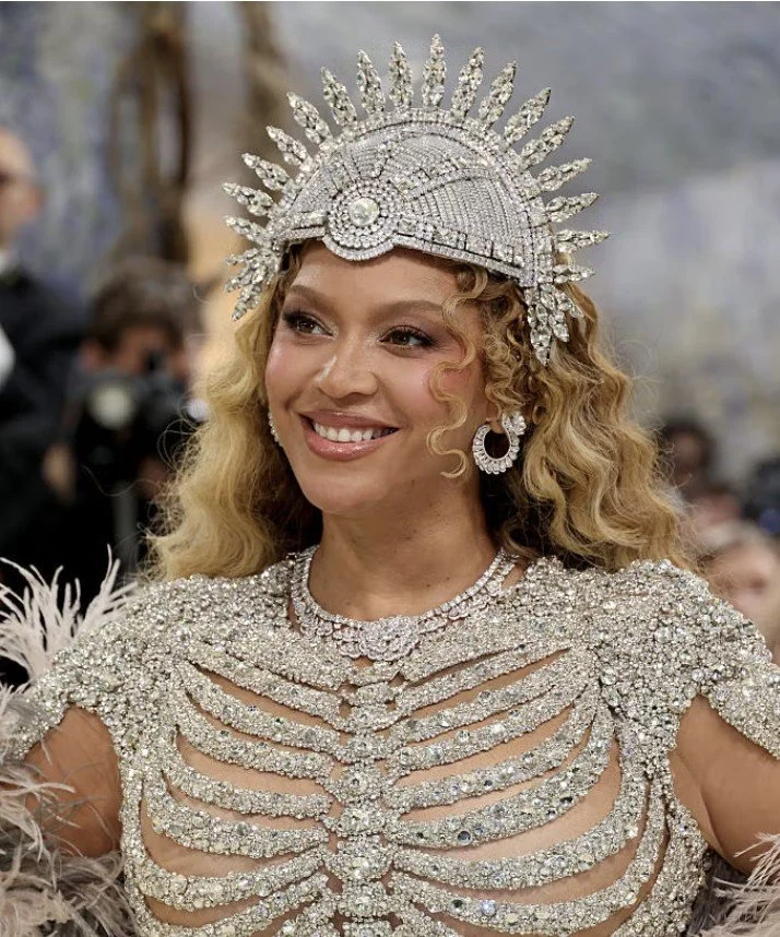 Beyonce on Met Gala 2026 red carpet with curly hair