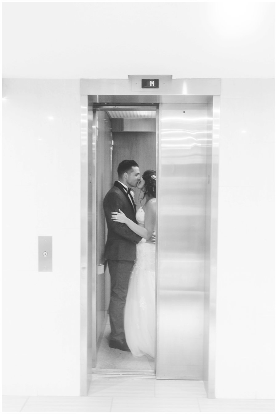 bride and groom in elevator