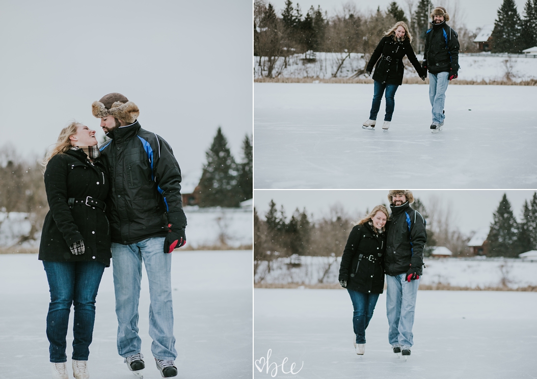 couple skating on outdoor pond in winter