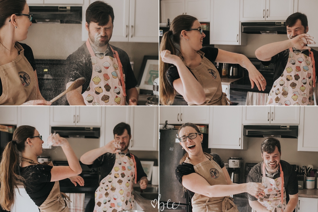 Engaged couple throws flour at each other while baking