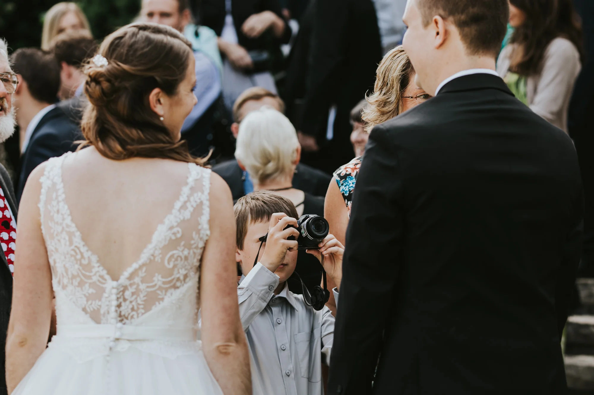This little guy's starting his photography business young! Good job little buddy